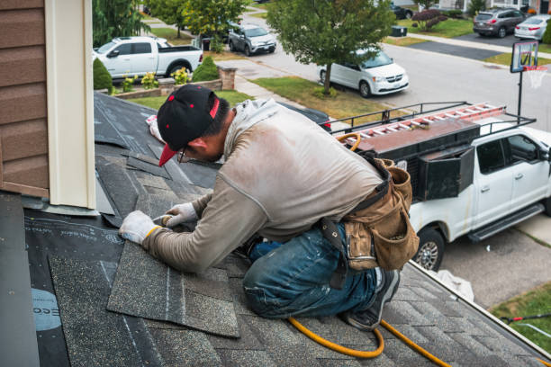 Professional Roofing technician working in Idlewild, MI